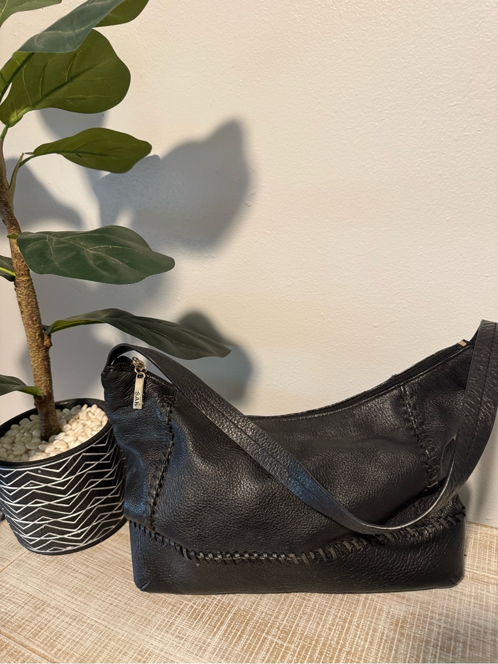 The Sak Black Leather Shoulder Bag with Whipstitch Detail
